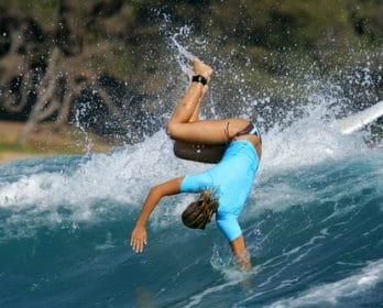 person falling while surfing
