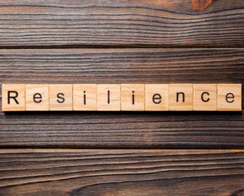 letter tiles forming the word resilience